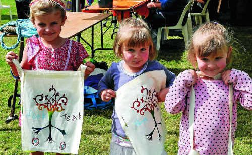 Teak, Nixie and Clove Wynn with their finished artwork. 